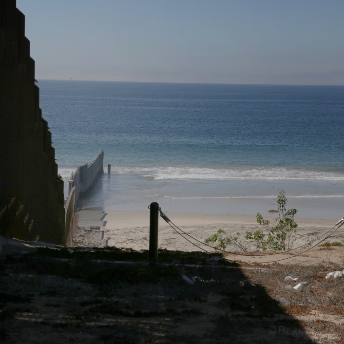01 Older Mexico-US border wall view into Pacific Ocean, California side